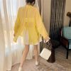 Ảnh của Áo sơ mi voan tay phồng KABICO áo sơ mi nữ xẻ sau khoác ngoài mặc đi biển, du lịch form rộng dài tay mỏng nhẹ